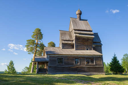 Medieval wooden church of St. George the Victorious close up on a sunny June morning. Side view. Rodionovo (Yuksovichi). Leningrad region, Russiaの写真素材