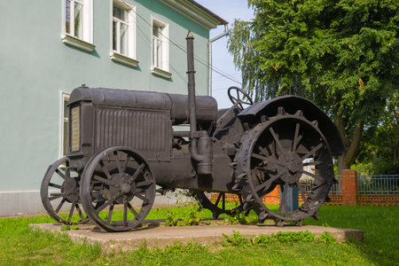 GDOV, RUSSIA - JULY 19, 2020: Old Soviet tractor SHTZ 15/30 close up. Monument at the building of the city museumのeditorial素材