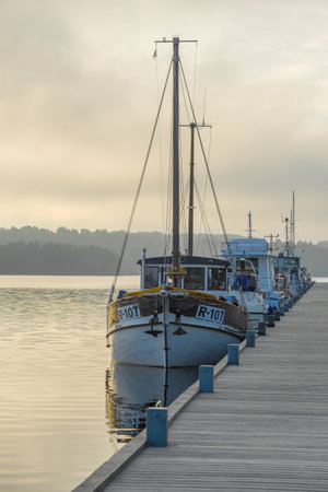 LAPPEENRANTA, FINLAND - JUNE 12, 2017: Foggy morning at the old wooden pier. Saimaa lakeのeditorial素材