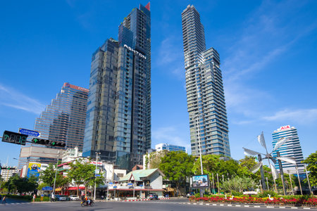 BANGKOK, THAILAND - JANUARY 01, 2019: Two modern high-rise buildings in a cityscape on a sunny day