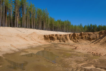 Sunny September day in a sand quarry. Kostroma region, Russia
