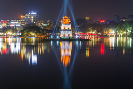 HANOI, VIETNAM - JANUARY 10, 2016: Ancient Turtle Tower on Hoan Kiem Lake in a city night landscapeのeditorial素材