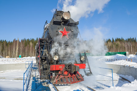 RUSKEALA, RUSSIA - MARCH 10, 2021: Soviet mainline freight steam locomotive of the "LV" series on the turning circle on a sunny March dayのeditorial素材