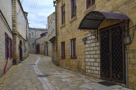 DERBENT, RUSSIA - SEPTEMBER 27, 2021: Old street in the ancient district (magal) on a cloudy September dayのeditorial素材