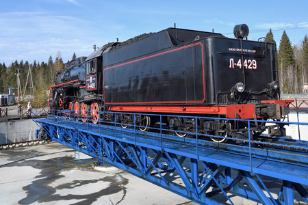 RUSKEALA, RUSSIA - OCTOBER 07, 2021: Soviet cargo steam locomotive L-4429 on a turning circle on a...
