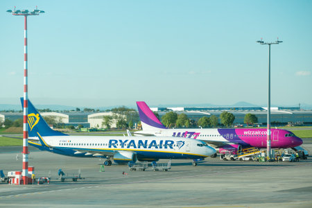 PRAGUE, CZECH REPUBLIC - APRIL 30, 2018: Airplanes of two European low-cost airlines Ryanair and Wizz Air on the airfield of Vaclav Havel International Airport on a sunny spring dayのeditorial素材