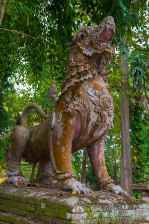 Ancient dragon sculpture on the ruins of Wat Phrathat Chedi Luang Buddhist temple. Chiang Saen,...