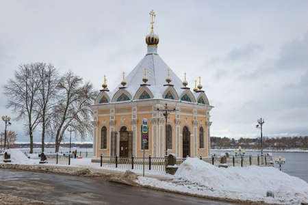 Old chapel of St. Nicholas the Wonderworker on a cloudy January day. Rybinsk. Yaroslavl region, Russiaの写真素材