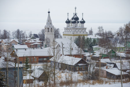 Ancient Church of the All-Merciful Savior (1723) in the cityscape on a cloudy December day. Belozersk, Vologda region. Russiaの写真素材