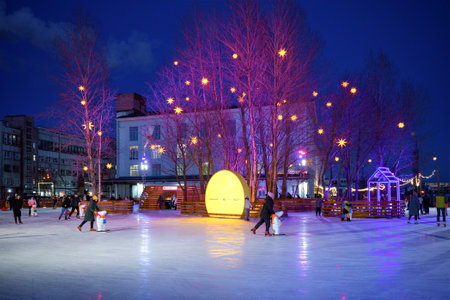 SAINT PETERSBURG, RUSSIA - FEBRUARY 22, 2022: February evening on the Sevkabel port ice rinkのeditorial素材