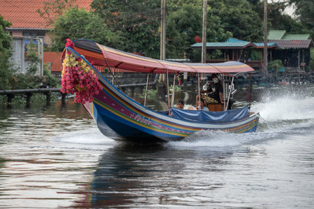 BANGKOK, THAILAND - DECEMBER 29, 2018: Traditional Thai motorboat on the city canal (klong)のeditorial素材