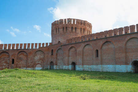 A fragment of an old city defensive wall and the Eagle Tower on a sunny July day. Smolensk, Russiaの写真素材