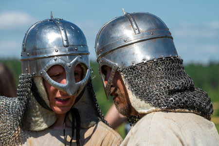 TVER REGION, RUSSIA - JULY 24, 2022: Two reenactors in Norman type helmets close-up. Historical festival "Epic Coast - 2022"のeditorial素材