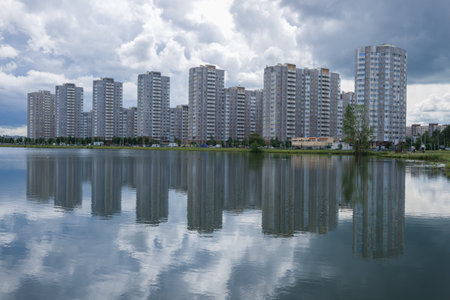 SAINT PETERSBURG, RUSSIA - JULY 12, 2020: View of the modern residential development of Dimitrova Street from the Kupchino quarries on a cloudy July dayの写真素材