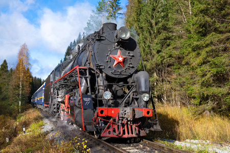 RUSKEALA, RUSSIA - OCTOBER 09, 2022: Old soviet "L" series steam locomotive with tourist train "Ruskeala Express" on the haul on a sunny October dayのeditorial素材