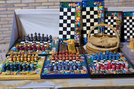 KHIVA, UZBEKISTAN - SEPTEMBER 07, 2022: Souvenir chess in national style on the street counter of the souvenir marketのeditorial素材
