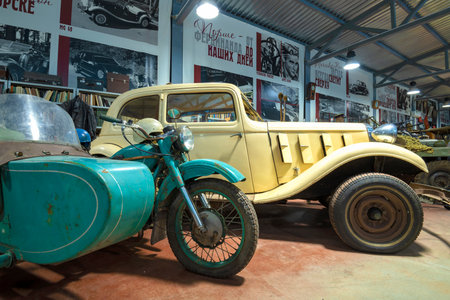 ZELENOGORSK, RUSSIA - JANUARY 27, 2023: Soviet motorcycle "Ural" and German car Hanomag Rekord Diesel Typ D (1938) in the Museum of retro cars of "Horsepower"のeditorial素材