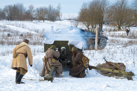 KRASNOYE SELO, RUSSIA - FEBRUARY 05, 2023: Soviet gunners fire on a German assault self-propelled gun. Military-historical reconstruction of the battles of the Great Patriotic Warのeditorial素材