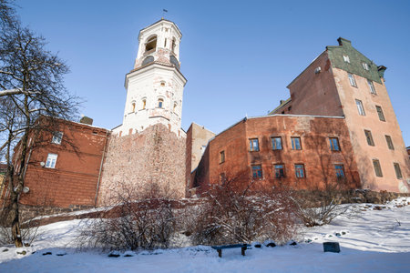 Ancient Clock Tower in the cityscape on a sunny March day. Vyborg. Leningrad region, Russiaの写真素材