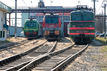 VOLKHOV, RUSSIA - APRIL 17, 2023: Three Russian electric locomotives at the building of the locomotive depot on the  Volkhovstroy 1 stationのeditorial素材