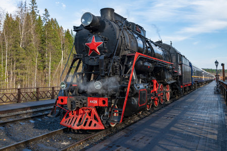 RUSKEALA, RUSSIA - OCTOBER 07, 2021: Old soviet steam locomotive L-4429 with a touristic retro train of the "Ruskeala Express" at the platform of the Ruskeala Mountain Park station on an October dayのeditorial素材