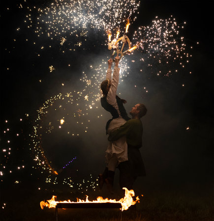 TVER REGION, RUSSIA - JULY 22, 2023: Fragment of the final scene of the performance of the fire group "Saga" on the historical festival "Epic Coast-2023"のeditorial素材