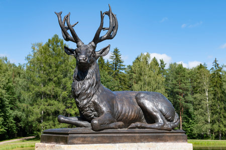 PAVLOVSK, RUSSIA - JULY 10, 2023: Sculpture of a deer on the Deer Bridge on a sunny July day. Pavlovsk Palace Park. Surroundings of St. Petersburgのeditorial素材