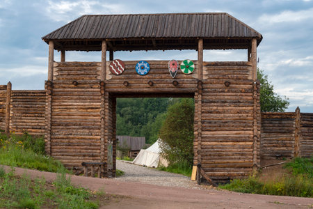 SHEVELEVO, RUSSIA - AUGUST 06, 2023: Gate of the wooden fortress. Ethnic settlement "Holmgard"のeditorial素材