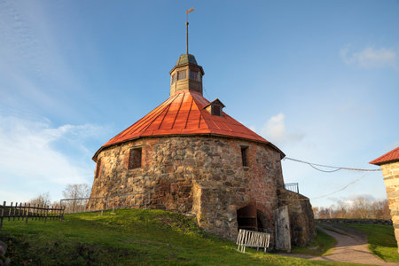 View of the ancient round tower of Lars Torstensson (Pugachev Tower) on a sunny October day. Korela fortress. Priozersk, Russiaのeditorial素材