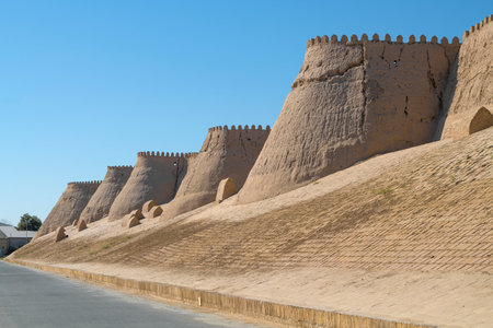 Ancient defensive wall of the inner city of Ichan-Kala on a sunny day. Khiva, Uzbekistanのeditorial素材
