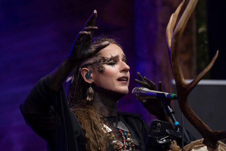 SHEVELEVO, RUSSIA - AUGUST 05, 2023: Soloist of the dark folk group "Meshchera" Alexandra Sidorova performs at the historical festival "Princely Brotherhood"のeditorial素材