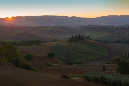 TUSCANA, ITALY - SEPTEMBER 21, 2017: Dawn rural landscape with the old villa Podere Belvedere. Neighborhoods of the city of San Quirico d'Orciaのeditorial素材