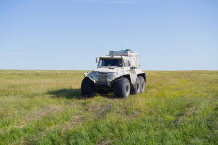 YAMAL, RUSSIA - AUGUST 22, 2018: Trakol all-terrain vehicle moves along the tundra on a sunny summer dayのeditorial素材