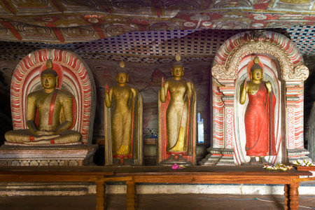 Ancient sculptures of Buddha in the decoration of the ancient Buddhist cave temple of Rangiri Dambulu Raja Maha Viharaya (Golden Temple). Dambulla, Sri Lankaのeditorial素材
