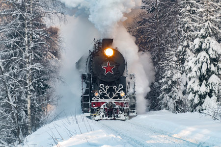RUSKEALA, RUSSIA - JANUARY 20, 2024: Soviet steam locomotive L-5031 (Lebedyanka) of the Ruskeala Express train in a snowy forest on a January morning. Kareliaのeditorial素材