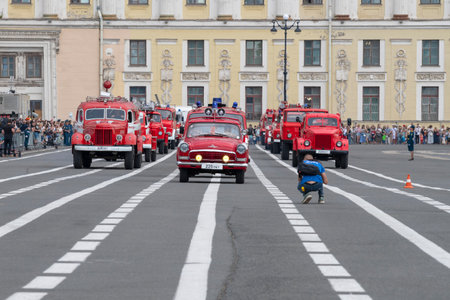 SAINT PETERSBURG, RUSSIA - JUNE 30, 2023: Convoy of retro firefighting vehicles on Palace Square. Fragment of the parade in honor of the 220th anniversary of the fire department of St. Petersburgのeditorial素材