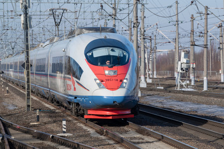 PETRO-SLAVYANKA, RUSSIA - MARCH 04, 2024: Approaching high-speed train EVS1-14 "Sapsan" on a sunny March day. Oktyabrskaya Railwayのeditorial素材