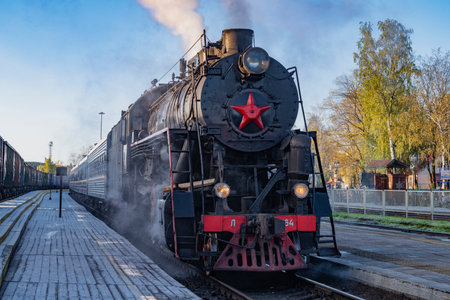 SORTAVALA, RUSSIA - OCTOBER 06, 2023: Retro train "Ruskeala Express" with an old Soviet steam locomotive of the "L" series on the platform of Sortavala station on a October morningのeditorial素材