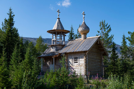 Wooden chapel of St. Nicholas the Wonderworker on a sunny July day. Kuelporr, Khibiny. Murmansk region, Russiaの写真素材