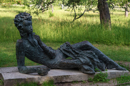 MIKHAILOVSKOYE, RUSSIA - JUNE 12, 2024: Sculpture "Pushkin the Lyceum Student" close-up on a June day. Mikhailovskoye Estate, Pushkinskie Goryのeditorial素材