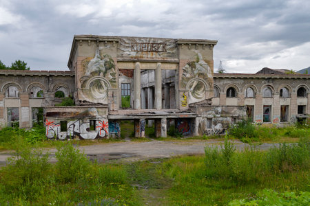 KIROVSK, RUSSIA - View of the facade of an abandoned old railway station building on a cloudy July dayの写真素材