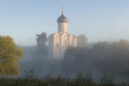 Medieval Church of the Intercession on the Nerl in the morning foggy landscape. Bogolyubovo, Golden Ring of Russiaの写真素材