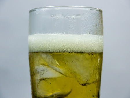 Glass of beer,beer and ice in glassの写真素材