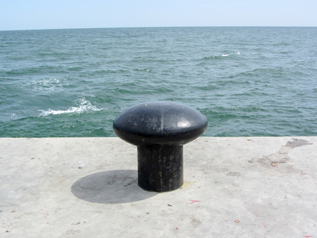 Iron pole for mooring of ships at wharfの写真素材