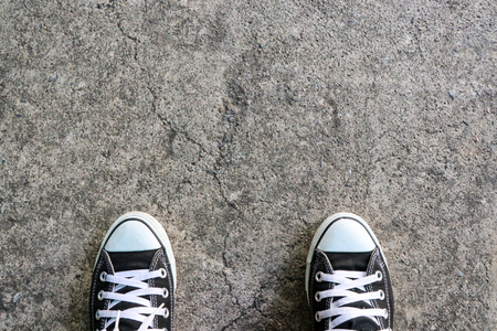 Sneakers tourists on cement floor use for backgroundの写真素材