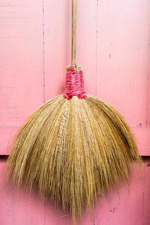 The broom hangs at the doorの写真素材