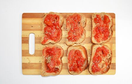 bruschetta's on a plate isolated on white backgroundの写真素材