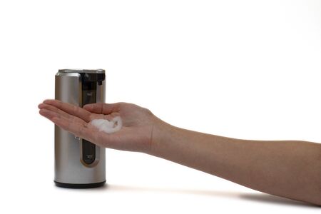 Putting foam soap on the handの写真素材