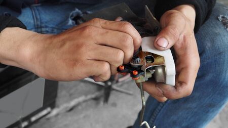 Repairman electric current Car lock in his handの写真素材