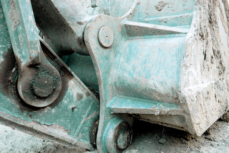 Loader working under construction, Photo crop behinde the parts, tools scoop of machine.の写真素材